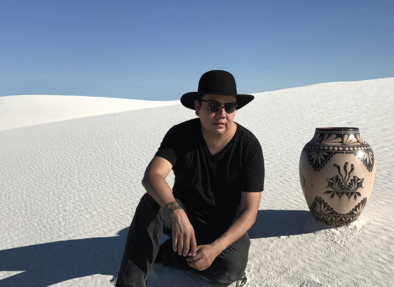 Futurist artist Virgil Ortiz sits in White Sands, New Mexico
